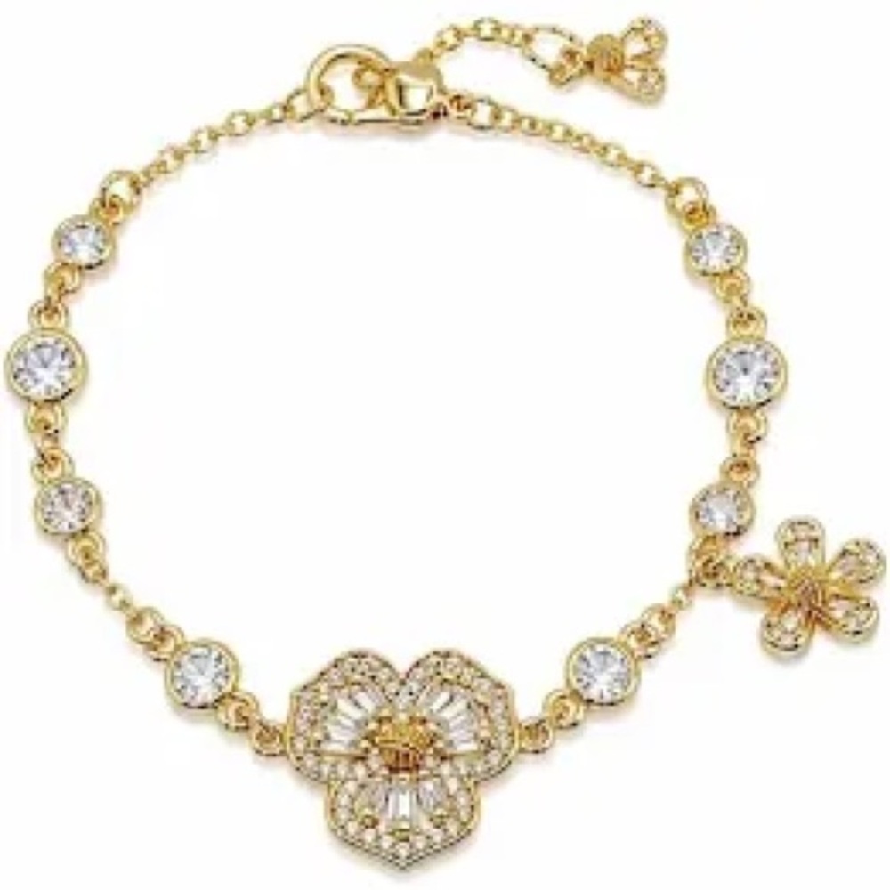 Authentic New with tag Kate spade crystal flower gold tone bracelet.